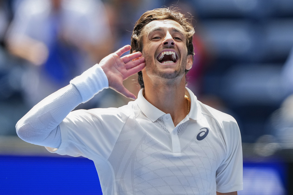 Lorenzo Musetti, of Italy, reacts after defeating David Goffin, of Belgium, during the second round of the U.S. Open tennis championships, Thursday, Aug. 28, 2025, in New York. (AP Photo/Yuki Iwamura)