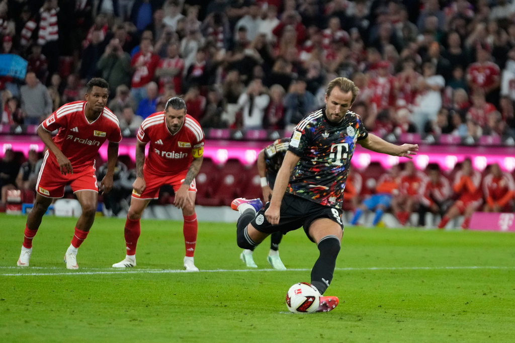 Bayern's Harry Kane scores his side's second goal by a penalty during the Bundesliga soccer match between Bayern Munich and 1. FC Union Berlin in Munich, Germany, Friday, Sept. 18, 2026. (AP Photo/Matthias Schrader)