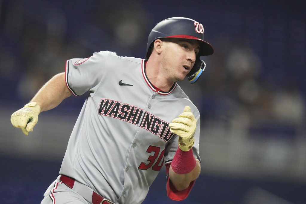 Washington Nationals' Jacob Young runs after hitting a single during the third inning of a baseball game against the Miami Marlins, Thursday, Sept. 11, 2025, in Miami. (AP Photo/Lynne Sladky)