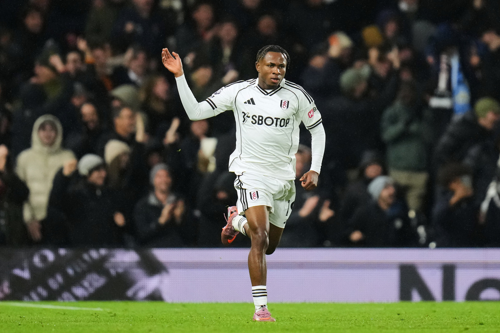 Fulham's Samuel Chukwueze celebrates after scoring his sides fourth goal during the English Premier League soccer match between Fulham and Manchester City in London, Tuesday, Dec. 2, 2025. (AP Photo/Kirsty Wigglesworth)