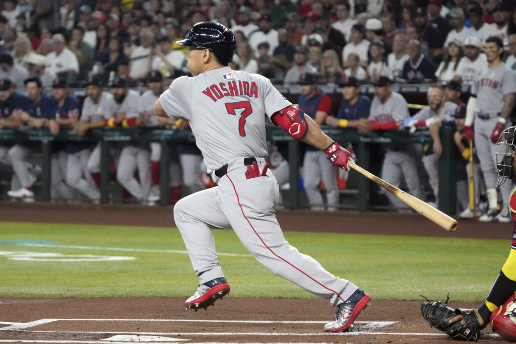 Boston Red Sox's Masataka Yoshida hits against the Arizona Diamondbacks in the first inning of a baseball game, Sunday, Sept 7, 2025, in Phoenix. (AP Photo/Rick Scuteri)