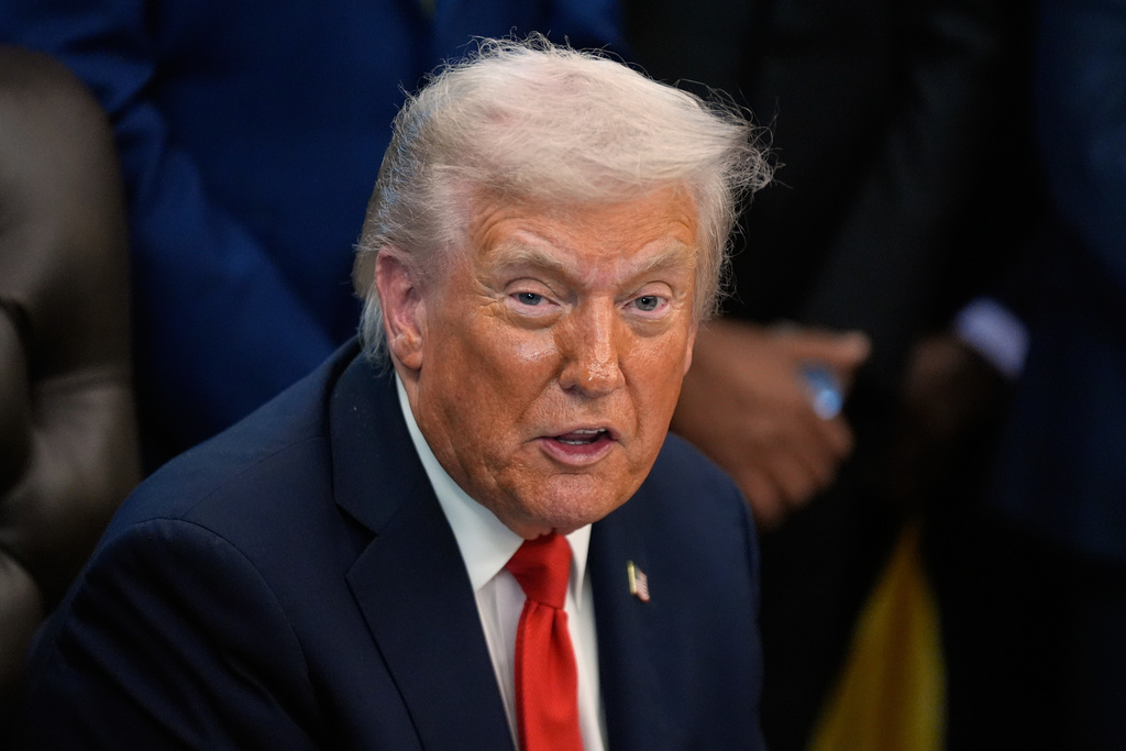 President Donald Trump answers questions from reporters during a Diwali celebration in the Oval Office at the White House, Tuesday, Oct. 21, 2025, in Washington. (AP Photo/Manuel Balce Ceneta)