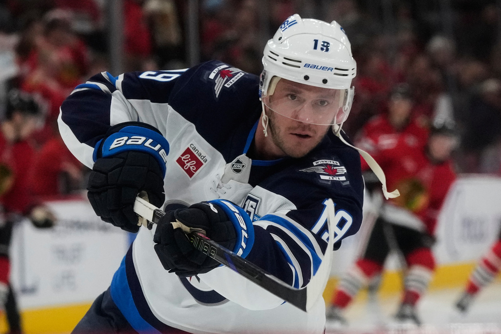 Winnipeg Jets center Jonathan Toews warms up before an NHL hockey game against the Chicago Blackhawks in Chicago, Monday, Jan. 19, 2026. (AP Photo/Nam Y. Huh)