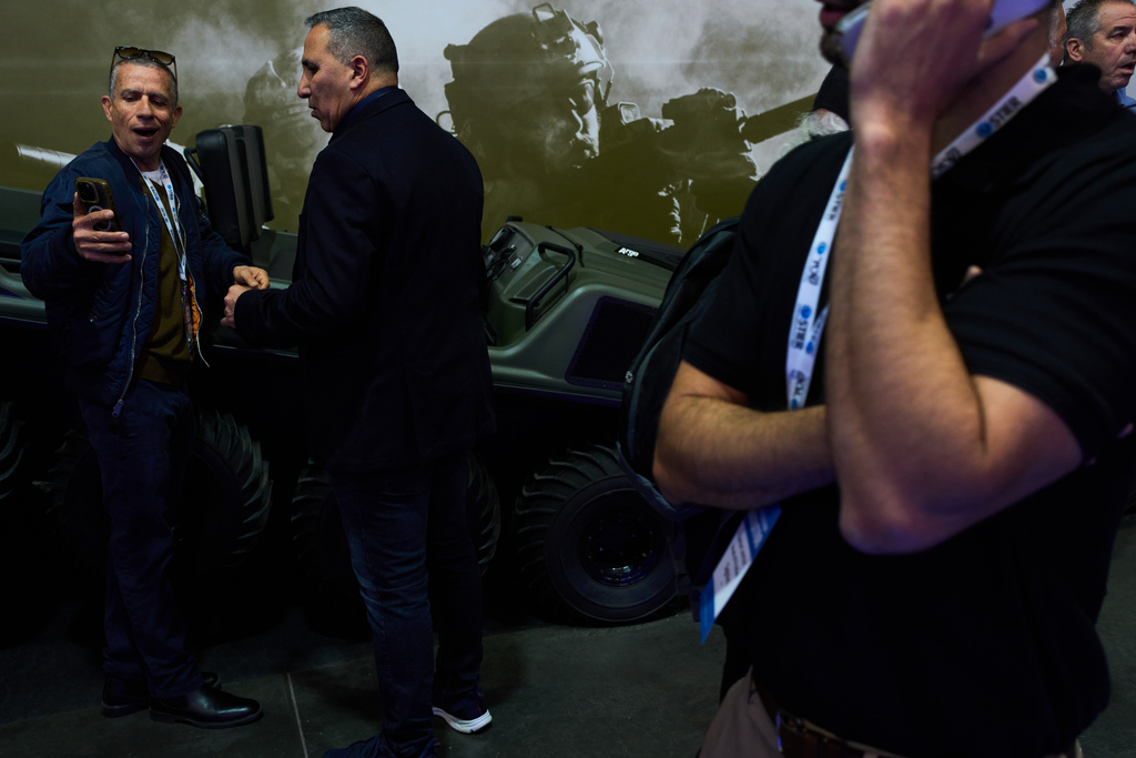 Visitors attend a defense industry exhibition in Tel Aviv, Israel, Tuesday, Feb. 17, 2026. (AP Photo/Oded Balilty)
