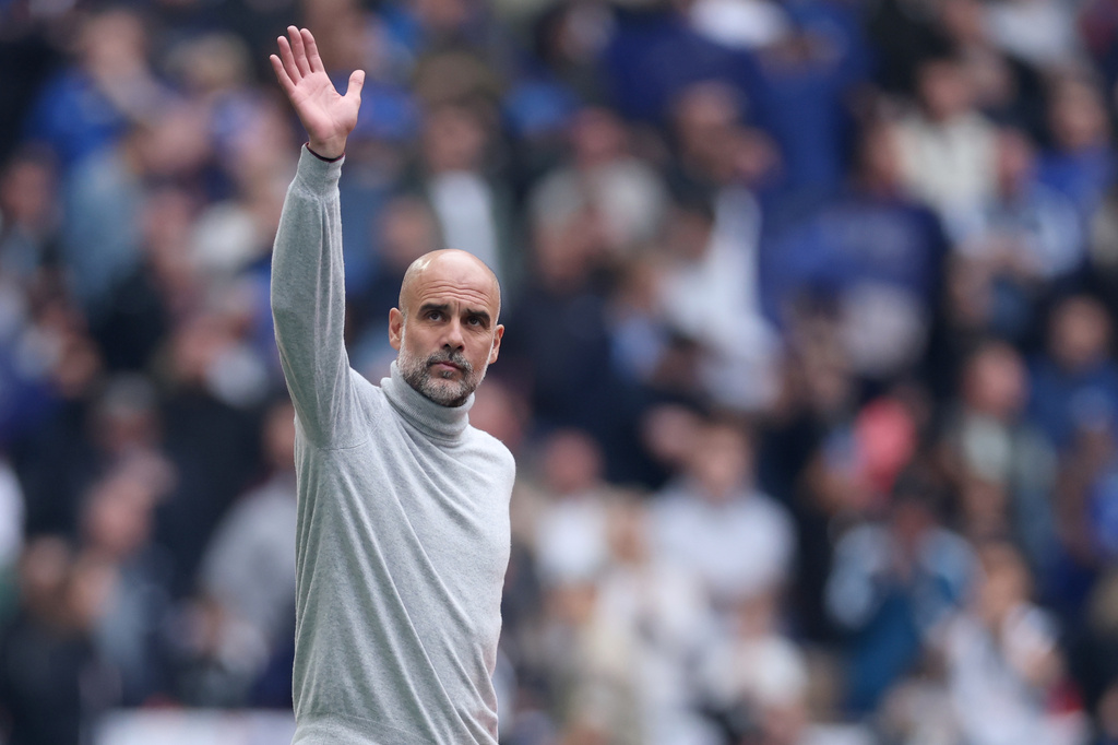 Manchester City's head coach Pep Guardiola greets fans before the English FA Cup final soccer match between Chelsea and Manchester City in London, Saturday, May 16, 2026. (AP Photo/Richard Pelham)
