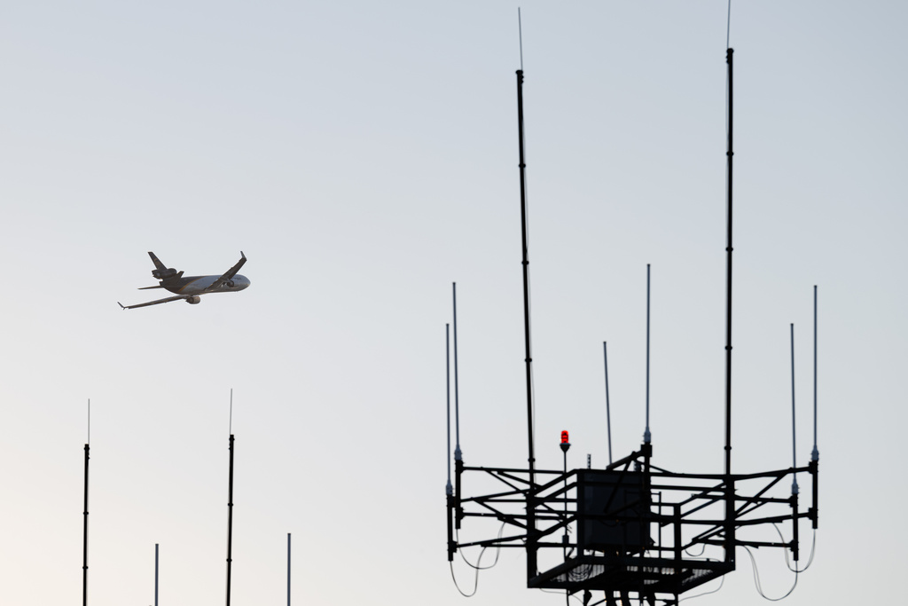 A UPS MD-11 takes off from Louisville Muhammad Ali International Airport on Wednesday, Nov. 5, 2025, in Louisville, Ky. (AP Photo/Jon Cherry)