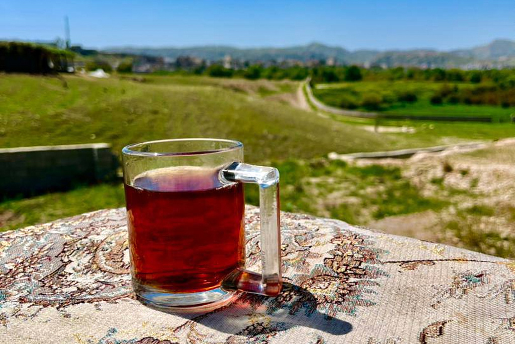 This photo provided by an Iranian lawyer who did not want to be identified shows a cup of tea at the lawyer's countryside home on Dec. 22, 2025, in Iran's Khuzestan province, where the family is seeking refuge from the U.S-Israeli strikes that fell too close to their city home. (Courtesy photo)