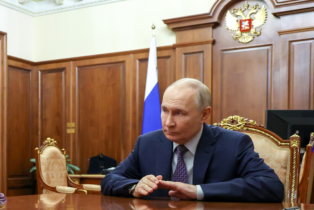 Russian President Vladimir Putin listens to Russian Deputy Prime Minister Tatyana Golikova during their meeting at the Kremlin, in Moscow, Tuesday, Feb. 10, 2026. (Vyacheslav Prokofyev/Sputnik, Kremlin Pool Photo via AP)