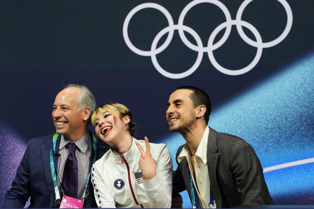 Alysa Liu of the United States reacts to her score after competing in the women's short program in figure skating at the 2026 Winter Olympics, in Milan, Italy, Tuesday, Feb. 17, 2026. (AP Photo/Natacha Pisarenko)