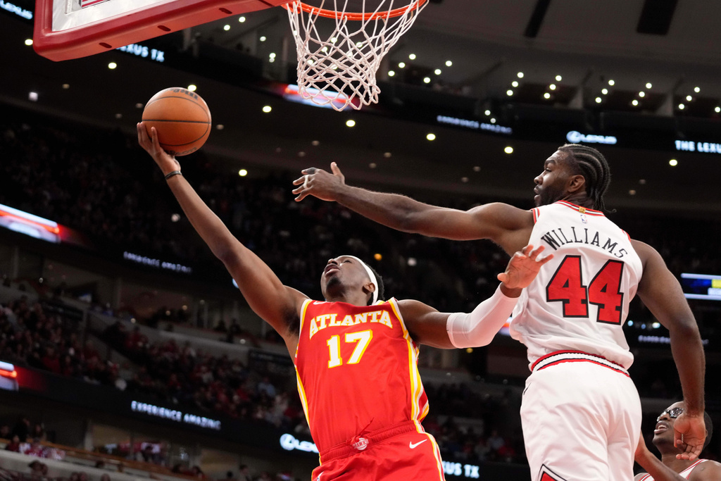 Atlanta Hawks forward Onyeka Okongwu (17) goes to the basket as Chicago Bulls forward Patrick Williams (44) defends during the first half of an NBA basketball game Monday, Oct. 27, 2025, in Chicago. (AP Photo/David Banks)