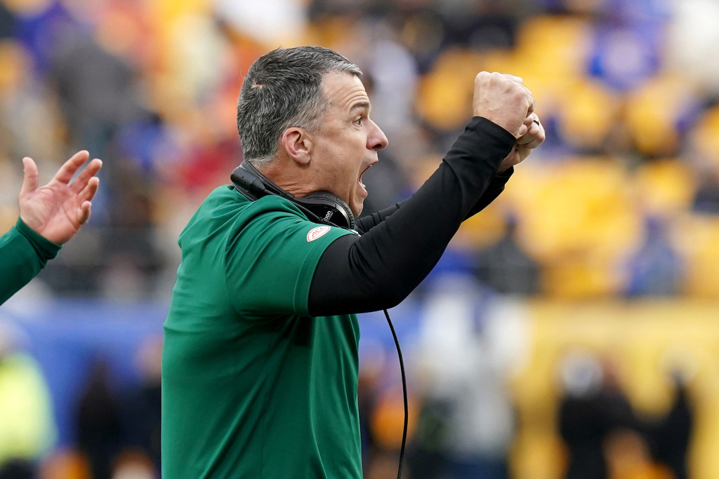 Miami head coach Mario Cristobal reacts after his team scored a touchdown during the second half of an NCAA college football game against Pittsburgh, Saturday, Nov. 29, 2025, in Pittsburgh. (AP Photo/Matt Freed)