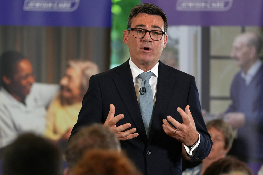 Britain's Prime Minister Andy Burnham speaks to residents, care workers, volunteers and social care stakeholders during a care home visit in London, Wednesday, July 29, 2026.(AP Photo/Kirsty Wigglesworth, Pool)