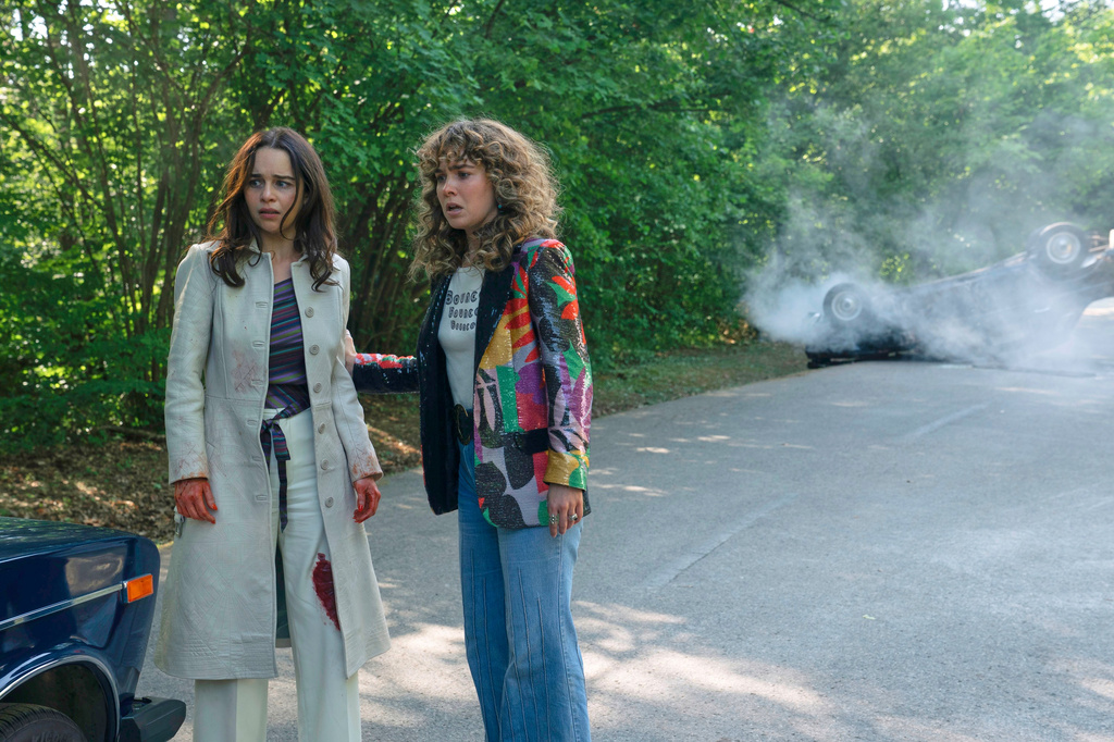 This image released by Peacock shows Emilia Clarke, left, and Haley Lu Richardson in a scene from "Ponies." (Katalin Vermes/Peacock via AP)