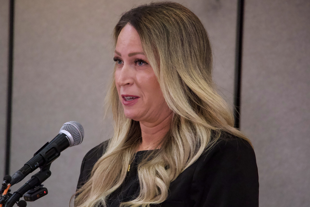 Laura Ah Loo, the widow of a man who was fatally shot during a "No Kings" protest in Salt Lake City in June, speaks to reporters at a news conference in the city Wednesday, Oct. 29, 2025. (AP Photo/Hannah Schoenbaum)