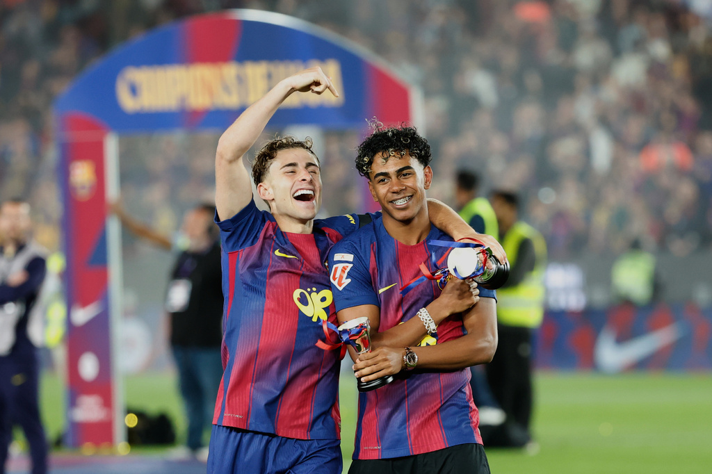 Barcelona's Gavi and Lamine Yamal celebrate after winning the Spanish La Liga soccer match against Real Madrid to clinch the Spanish league title in Barcelona, Spain, Sunday, May 10, 2026. (AP Photo/Joan Monfort)