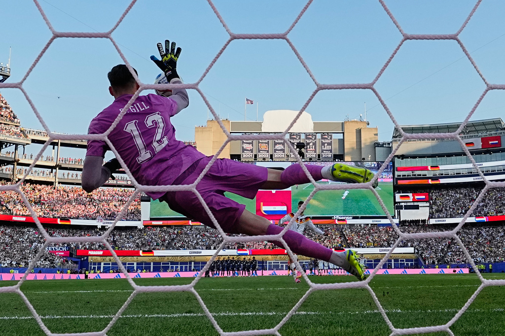Paraguay goalkeeper Orlando Gill (12) makes a save from Germany's Kai Havertz (7) during a penalty shootout during the World Cup round of 32 soccer match between Germany and Paraguay in Foxborough, Mass., near Boston, Monday, June 29, 2026. (AP Photo/Martin Meissner)