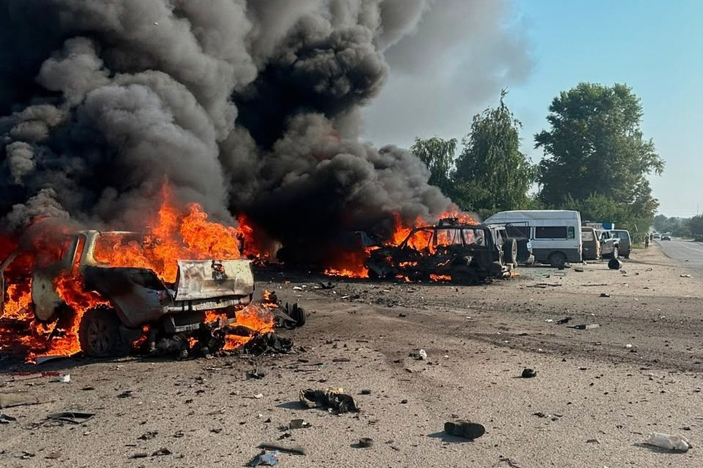 In this photo provided by the Ukrainian Emergency Service, fire is seen on the site of a Russian air attack in Pechenihy, Kharkiv region, Ukraine, Tuesday, Aug. 18, 2026. (Ukrainian Emergency Service via AP)