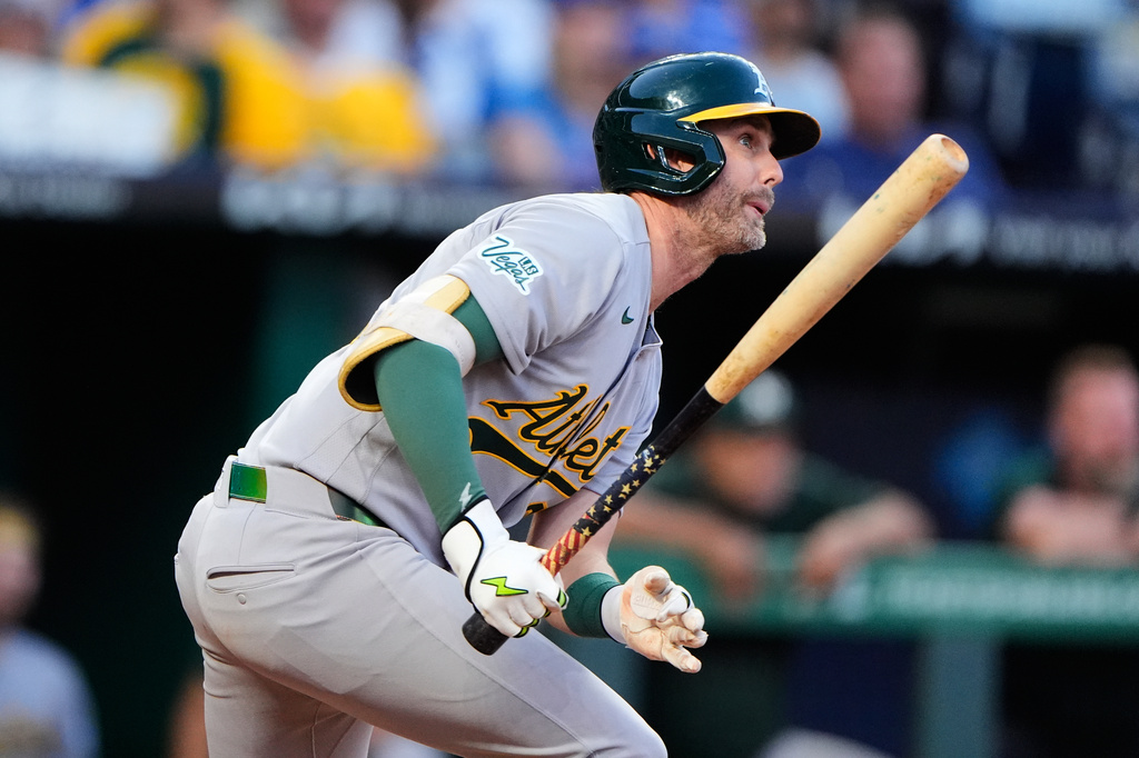 Athletics' Jeff McNeil watches his RBI single during the fifth inning of a baseball game against the Kansas City Royals, Wednesday, Aug. 19, 2026, in Kansas City, Mo. (AP Photo/Charlie Riedel)