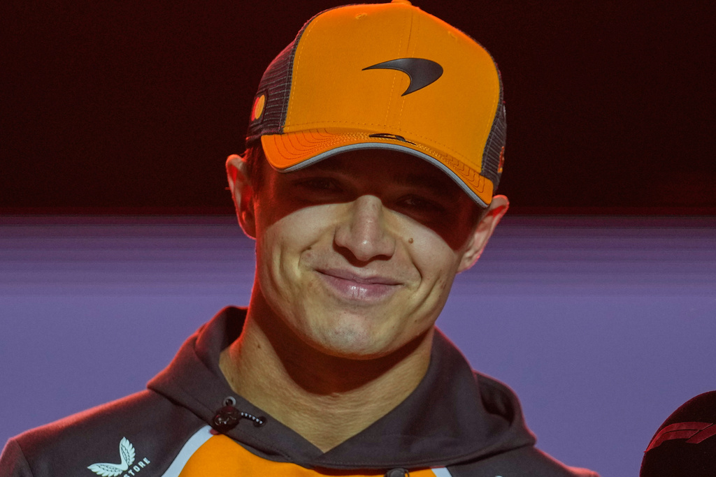 McLaren driver Lando Norris of Britain smiles during an interview before the start of the Qatar Formula One Grand Prix, in Lusail, Qatar, Sunday, Nov. 30, 2025.(AP Photo/Altaf Qadri)