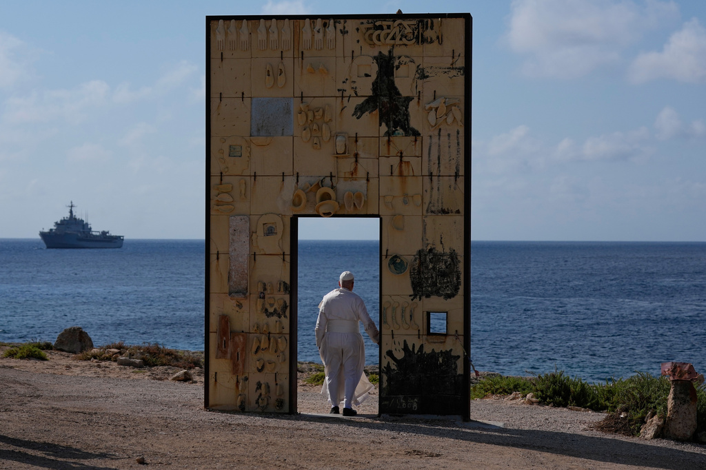 Pope Leo XIV visits the Gateway of Europe monument in Lampedusa, Sicily, southern Italy, Saturday, July 4, 2026, during a one-day pastoral visit to the island long associated with the plight of migrants crossing the Mediterranean. (AP Photo/Alessandra Tarantino)