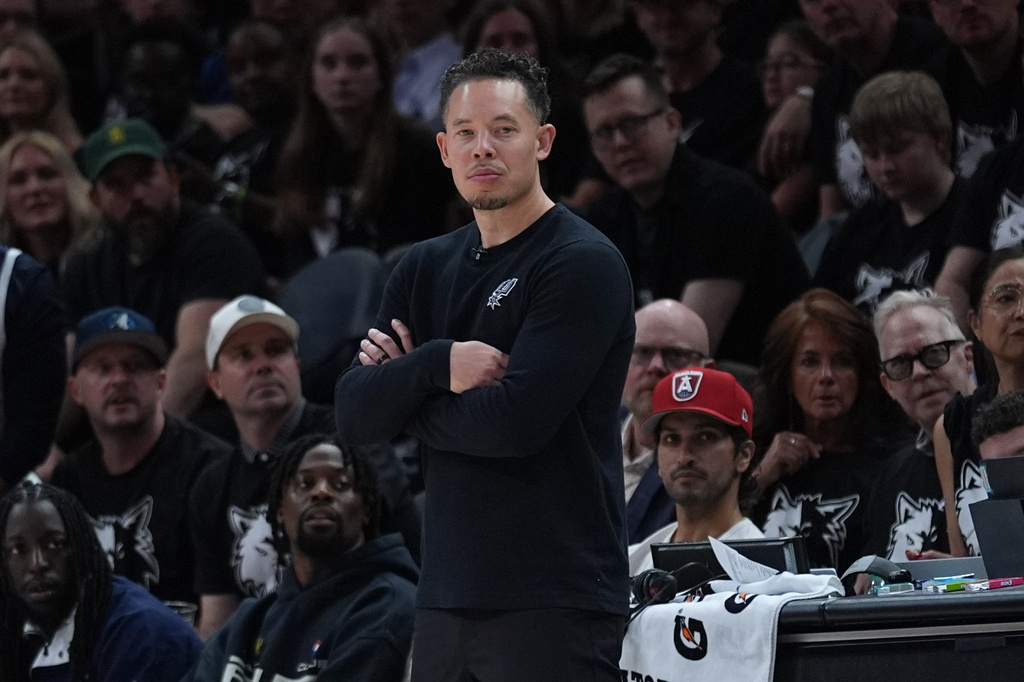 San Antonio Spurs head coach Mitch Johnson watches from the bench during the first half of Game 6 of an NBA basketball second-round playoffs series against the Minnesota Timberwolves in Minneapolis, Friday, May 15, 2026. (AP Photo/Abbie Parr)