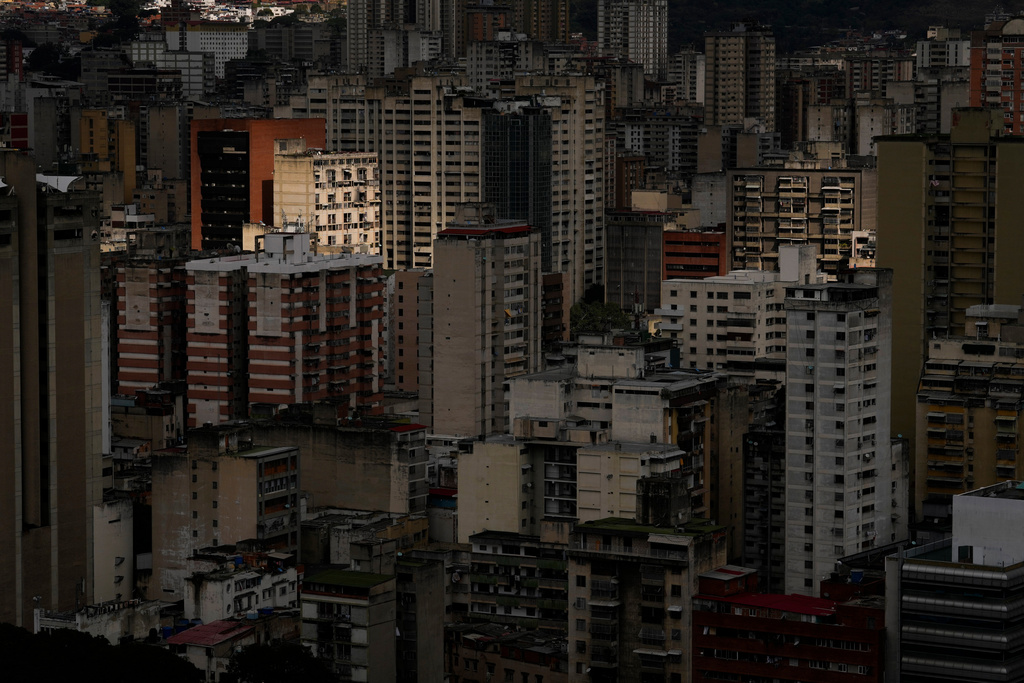 Buildings stand in Caracas, Venezuela, Tuesday morning, Dec. 23, 2025. (AP Photo/Matias Delacroix)