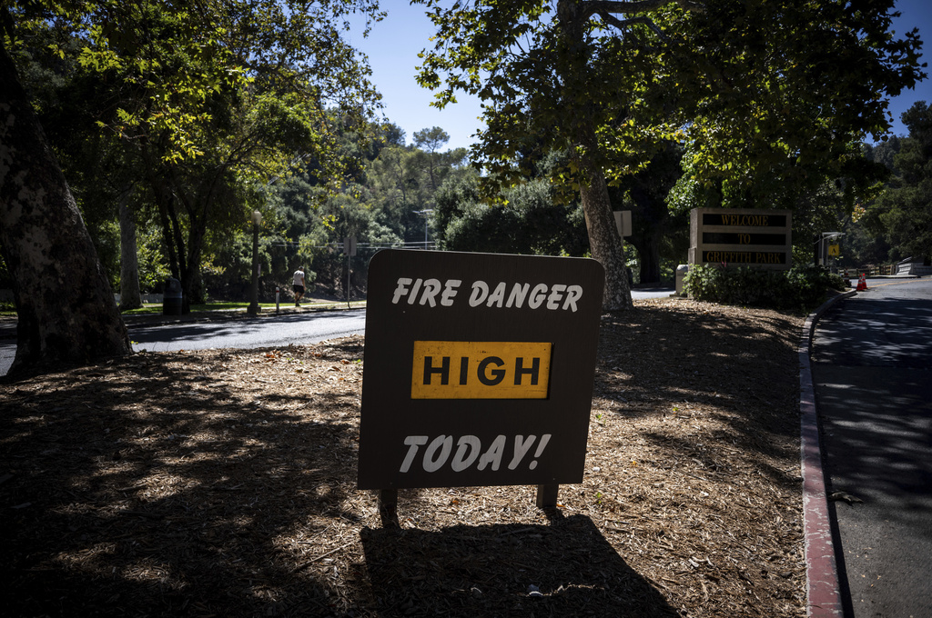 A sign warns of high fire danger at Griffith Park in Los Angeles, Tuesday, Aug. 19, 2025. (AP Photo/Jae C. Hong)