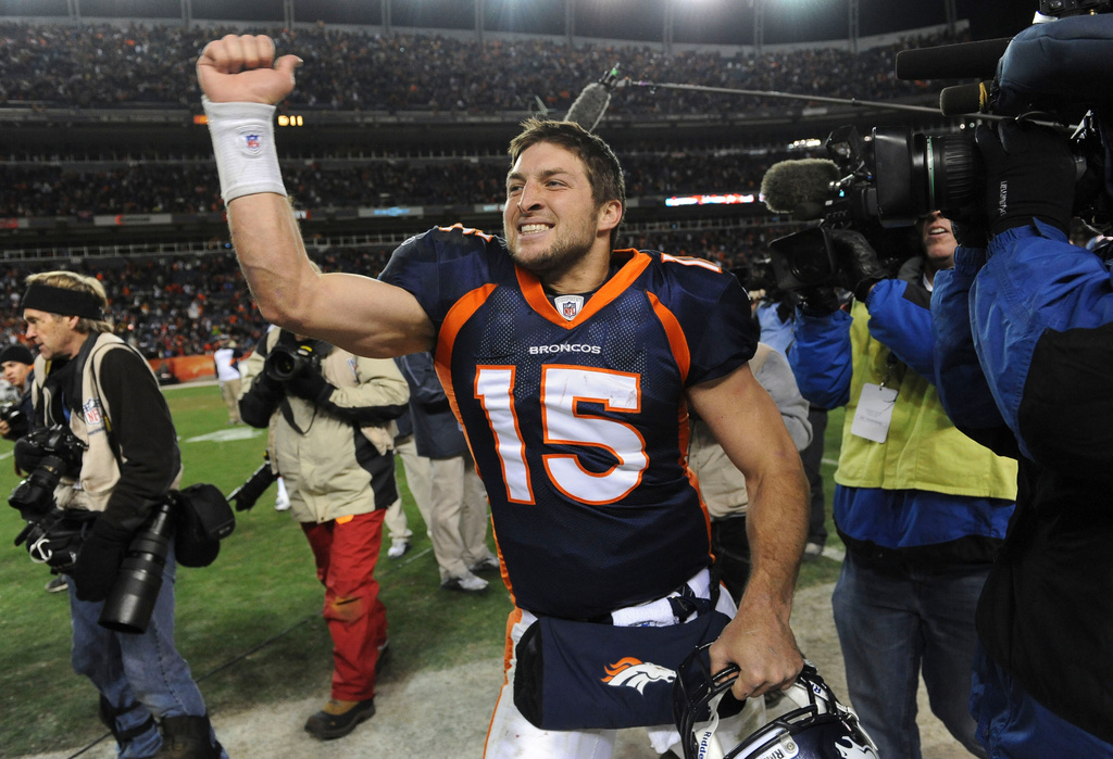 FILE - Denver Broncos quarterback Tim Tebow (15) celebrates after beating the Pittsburgh Steelers 29-23 in overtime of an NFL wild card playoff football game Sunday, Jan. 8, 2012, in Denver. (AP Photo/Chris Schneider, File)