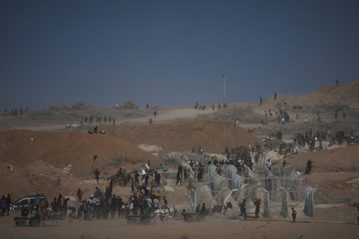 Palestinians inspect the remains of a site that housed a distribution center operated by the U.S.-backed Gaza Humanitarian Foundation (GHF) in Netzarim, central Gaza Strip, Friday, Oct. 10, 2025, after Israel and Hamas agreed to pause their war and release the remaining hostages. (AP Photo/Jehad Alshrafi) Palestinians inspect the remains of a site that housed a distribution center operated by the U.S.-backed Gaza Humanitarian Foundation (GHF) in Netzarim, central Gaza Strip, Friday, Oct. 10, 2025, after Israel and Hamas agreed to pause their war and release the remaining hostages. (AP Photo/Jehad Alshrafi)