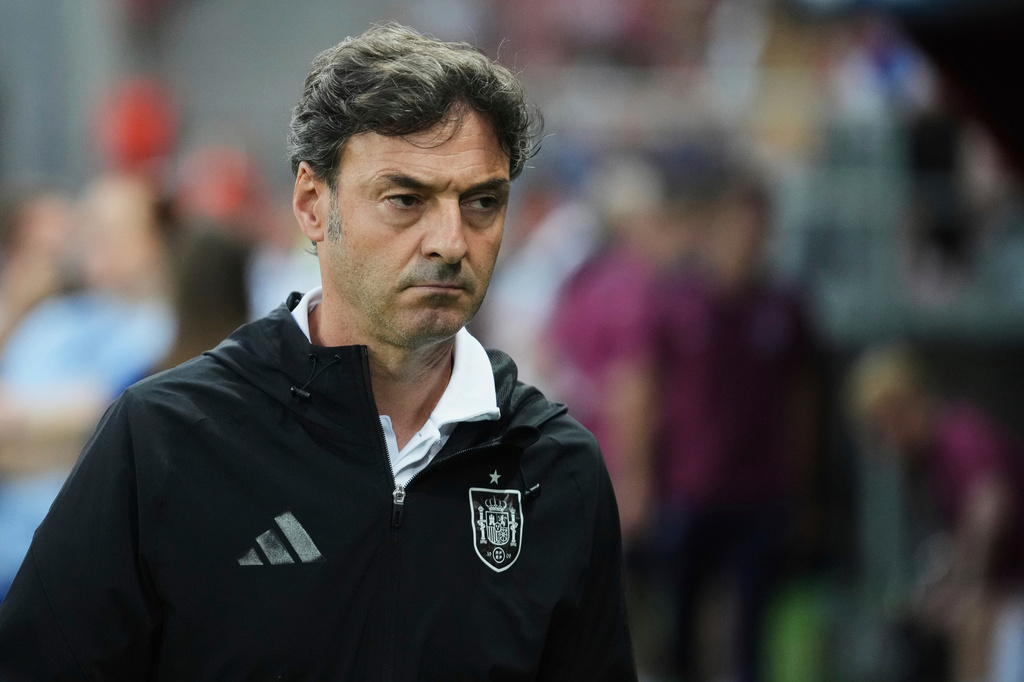 FILE - Spain's coach Santi Denia walks prior to a quarter final soccer match between Spain and England at the European U-21 Championship at the Anton Malatinsky Stadium, in Trnava, Slovakia, Saturday, June 21, 2025. (AP Photo/Petr David Josek, file)