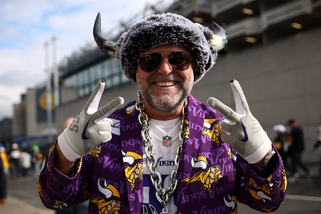 A supporter poses for photographers before the start of the NFL football game between Minnesota Vikings and Pittsburgh Steelers at Croke Park stadium in Dublin, Sunday, Sept. 28, 2025.(AP Photo/Peter Morrison)