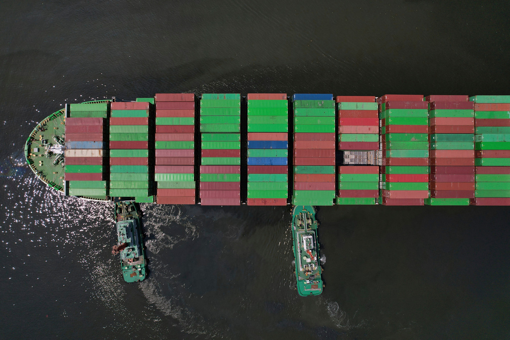 FILE - Tugboats assist a container ship as it prepares to dock at the Manila International Container Terminal at the Philippine capital April 8, 2025. (AP Photo/Aaron Favila, File)