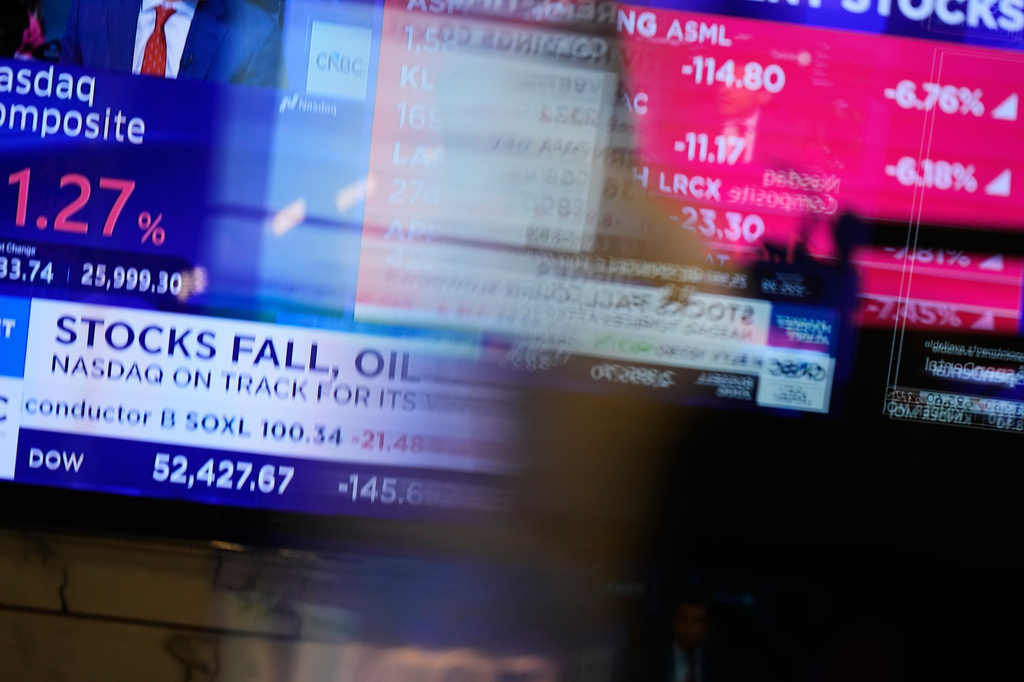 Electronic displays show financial news on the floor at the New York Stock Exchange in New York, Monday, Sept. 14, 2026. (AP Photo/Seth Wenig)