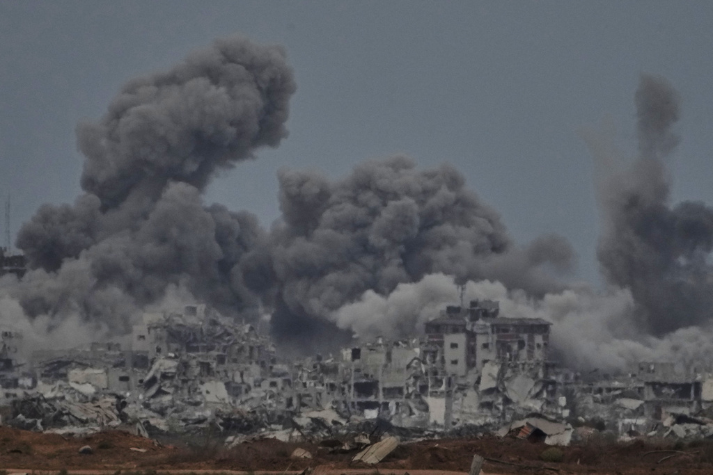 Smoke rises to the sky following an Israeli military strike in the Gaza Strip, as seen from southern Israel, Thursday, Oct. 9, 2025, following the announcement that Israel and Hamas have agreed to the first phase of a peace plan to pause the fighting. (AP Photo/Ariel Schalit)