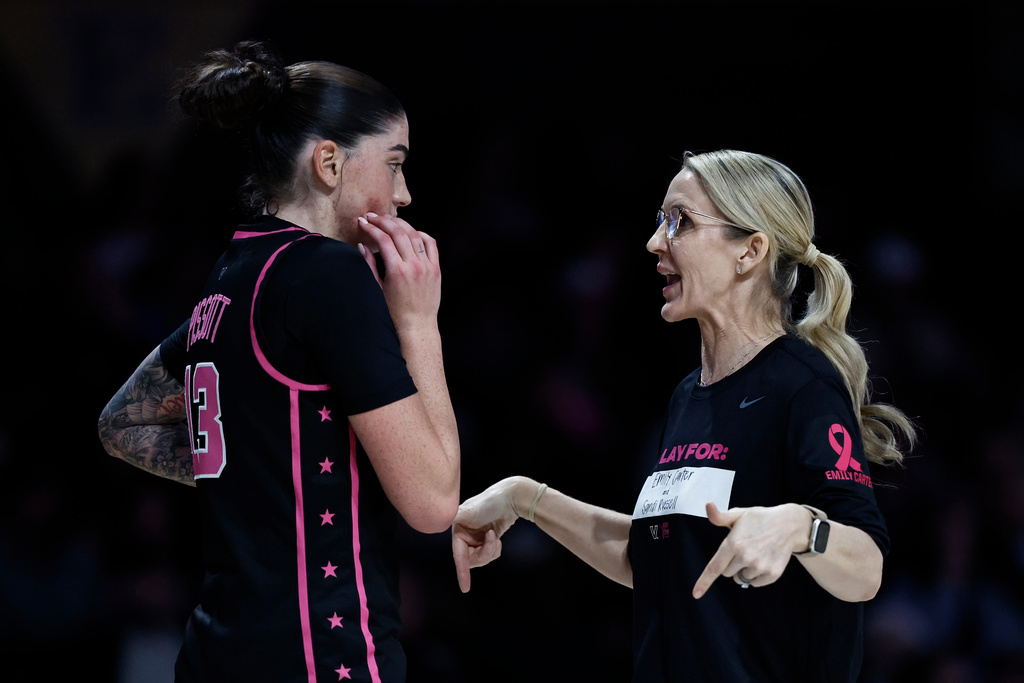 Vanderbilt head coach Shea Ralph, right, talks to Justine Pissott (13) during the second half of an NCAA college basketball game against Oklahoma, Monday, Feb. 9, 2026, in Nashville, Tenn. (AP Photo/Wade Payne)
