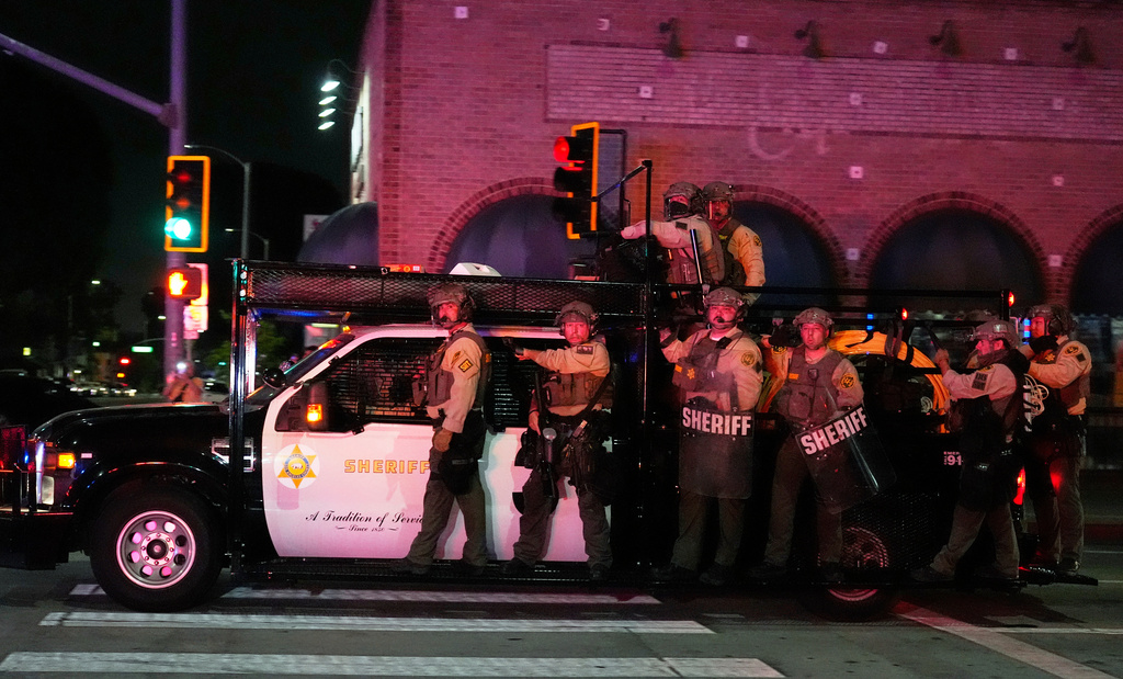 FILE - Los Angeles County Sheriff's deputies arrive to respond to ICE protests on Wednesday, June 11, 2025, in Whittier, Calif. (AP Photo/Chris Pizzello, File)