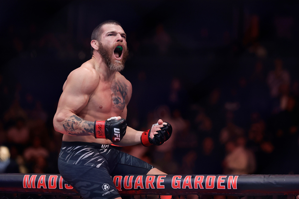 FILE - Jim Miller reacts after defeating Damon Jackson in a UFC 309 mixed martial arts lightweight title bout, Nov. 16, 2024, in New York. (AP Photo/Adam Hunger, File)