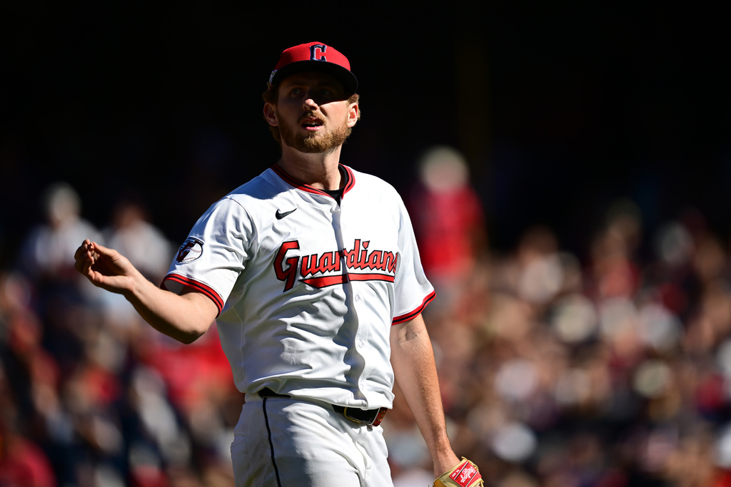Cleveland Guardians starting pitcher Tanner Bibee walks back to the dugout during a pitching change in the fifth inning of Game 2 of the American League Wild Card baseball playoff series against the Detroit Tigers in Cleveland, Wednesday, Oct. 1, 2025. (AP Photo/David Dermer)