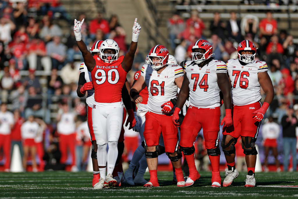 Rutgers defensive lineman Farell Gnago (90) reacts after making a tackle during the first half of an NCAA college football game against Maryland, Saturday, Nov. 8, 2025, in Piscataway, N.J. (AP Photo/Adam Hunger)