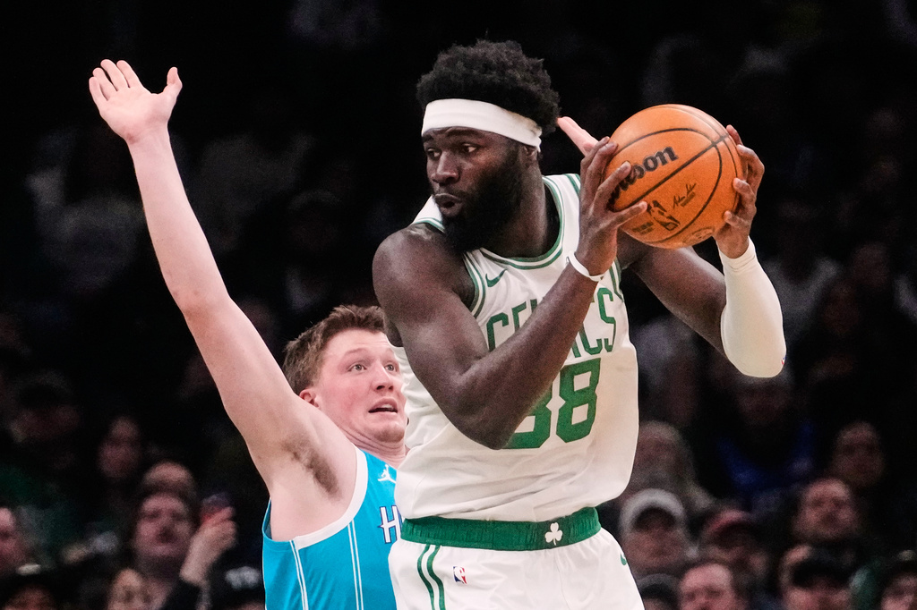 Boston Celtics center Neemias Queta (88) prepares to drive on Charlotte Hornets guard Kon Knueppel (7) during the first half of a NBA basketball game, Tuesday, April 7, 2026, in Boston. (AP Photo/Charles Krupa)