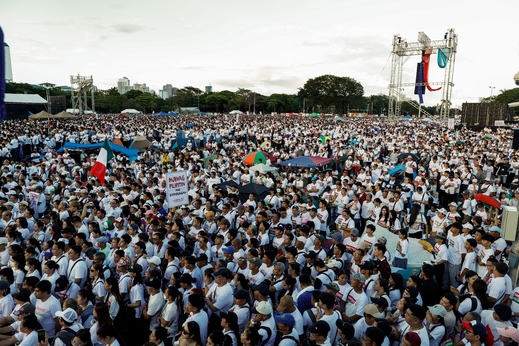 Members of the religious sect Iglesia Ni Cristo (Church of Christ) gather during a three-day anti-corruption rally at Manila's Rizal Park, Philippines on Sunday, Nov. 16, 2025. (AP Photo/Mark Cristino)