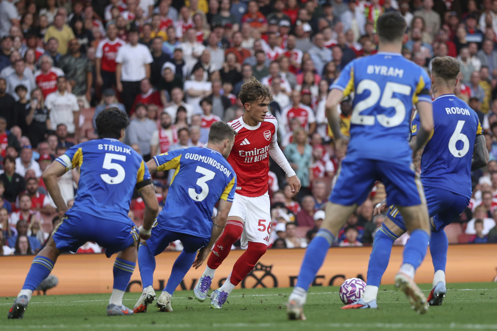 Arsenal's Max Dowman is closed down by the Leeds defence during the English Premier League soccer match between Arsenal and Leeds United at Emirates stadium in London, England, Saturday, Aug. 23, 2025. (AP Photo/Ian Walton)