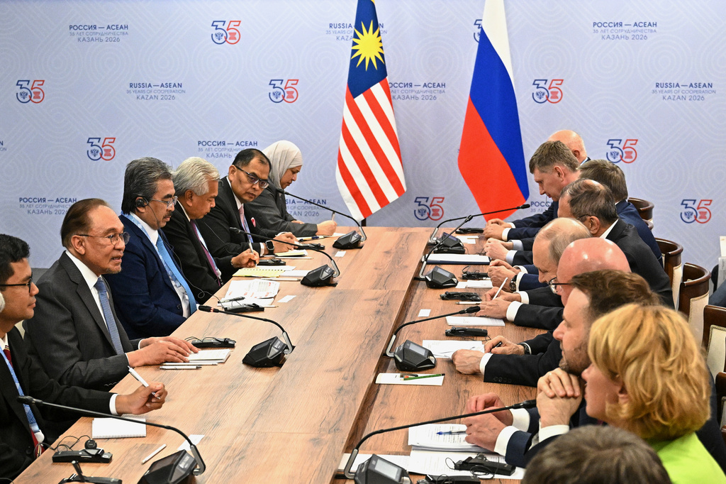 Russian President Vladimir Putin, fourth right, and Malaysian Prime Minister Anwar Ibrahim, second left, attend a talks on the sidelines of the Russia-ASEAN summit in Kazan, Russia, Wednesday, June 17, 2026. (Sergei Bobylev/Sputnik, Kremlin Pool Photo via AP)