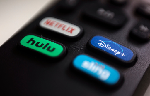 FILE - The logos for streaming services Netflix, Hulu, Disney Plus and Sling TV are pictured on a remote control on Aug. 13, 2020, in Portland, Ore. (AP Photo/Jenny Kane, File) FILE - The logos for streaming services Netflix, Hulu, Disney Plus and Sling TV are pictured on a remote control on Aug. 13, 2020, in Portland, Ore. (AP Photo/Jenny Kane, File)