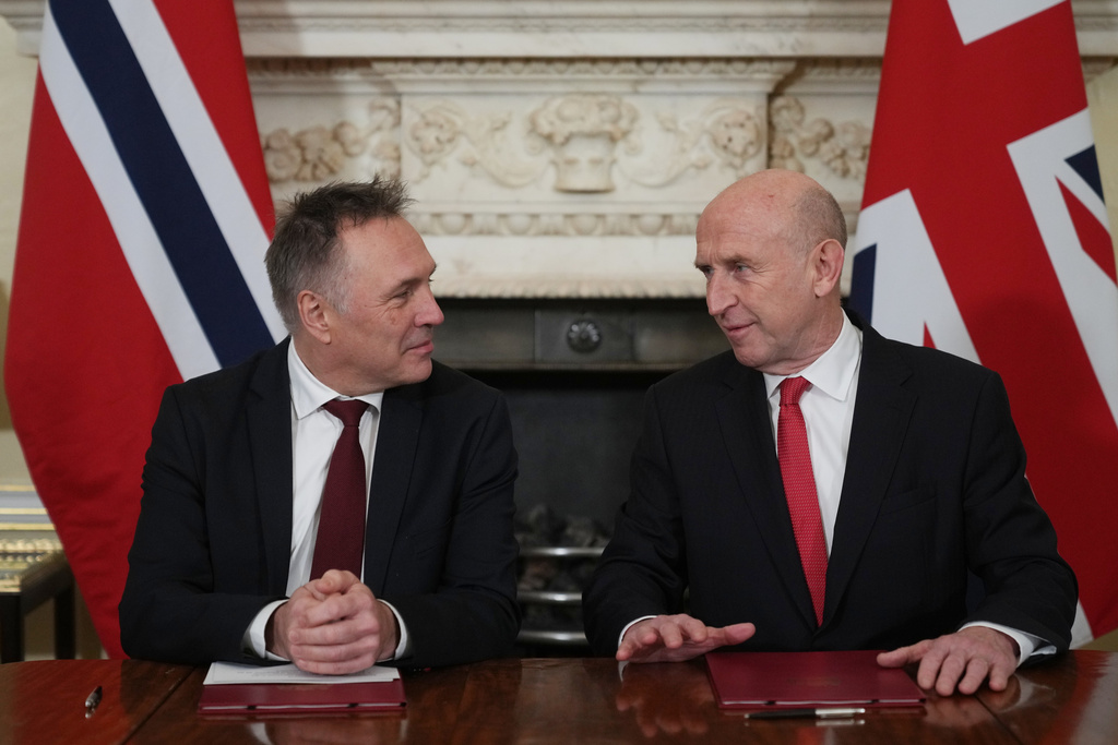 Norway's Minister of Defence Tore O. Sandvik, left, and Britain's Secretary of State for Defence John Healey during the signing of a Strategic Defence Agreement in London, Thursday, Dec. 4, 2025. (AP Photo/Alastair Grant, pool)