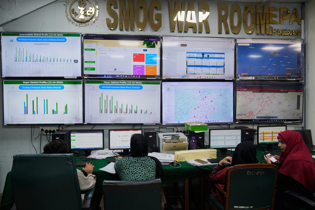 Employees of Environment Protection Agency monitor smog and air quality in a monitoring room, called the Smog Cell, in Lahore, Pakistan, Thursday, Oct. 23, 2025. (AP Photo/K.M. Chaudary)