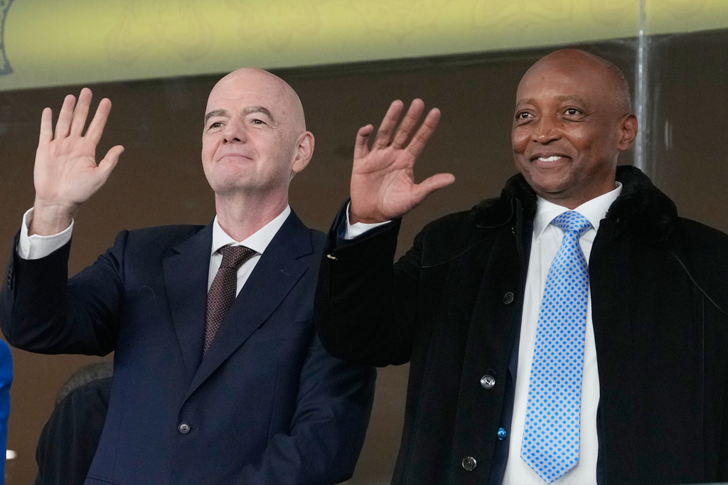 FILE - CAF President Patrice Motsepe and FIFA President Gianni Infantino wave from the tribune during the Africa Cup of Nations round of 16 soccer match between South Africa and Cameroon in Rabat, Morocco, Sunday, Jan. 4, 2026. (AP Photo/Themba Hadebe, File)
