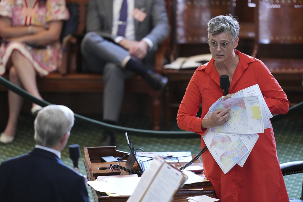 Texas state Sen. Sarah Eckhardt, D-Austin, right, questions Sen. Phil King, R-Weatherford, during debate over a bill before a vote on a redrawn U.S. congressional map during a special session in the Senate Chamber at the Texas Capitol in Austin, Texas, Friday, Aug. 22, 2025. (AP Photo/Eric Gay)