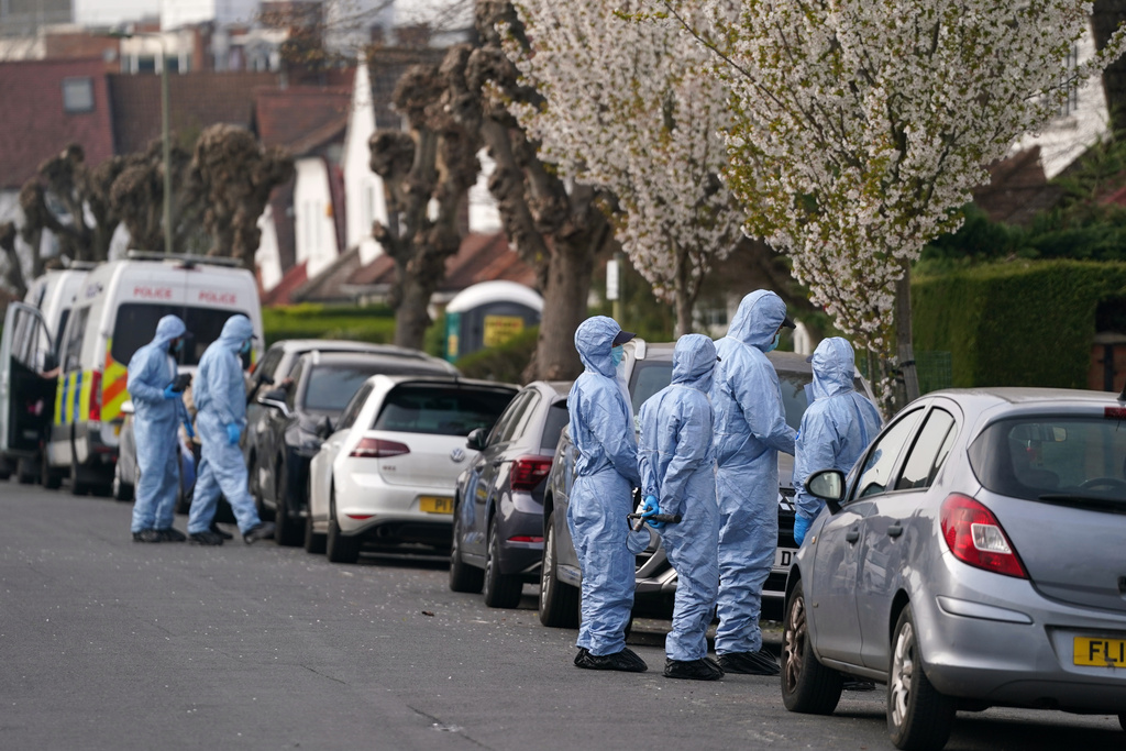 Forensics get ready to investigate the area in Goldedr Green in London, Monday, March 23, 2026 after an arson attack on four vehicles belonging to a Jewish ambulance service, Hatzola Northwest, in London.(AP Photo/Alberto Pezzali)