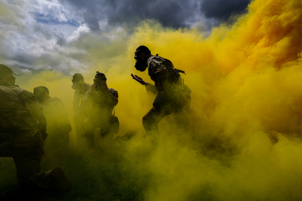 A West Point cadet dons a gas mask while running through smoke during the crucible portion of the Sandhurst Military Skills Competition at the United States Military Academy in West Point, N.Y., Saturday, May 2, 2026. (AP Photo/Julia Demaree Nikhinson)